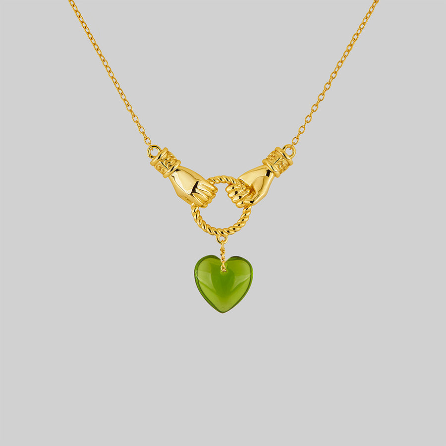 gold hand heart necklace