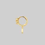 gold hoop earring with moon and gemstone