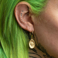 Gold sun coin earrings