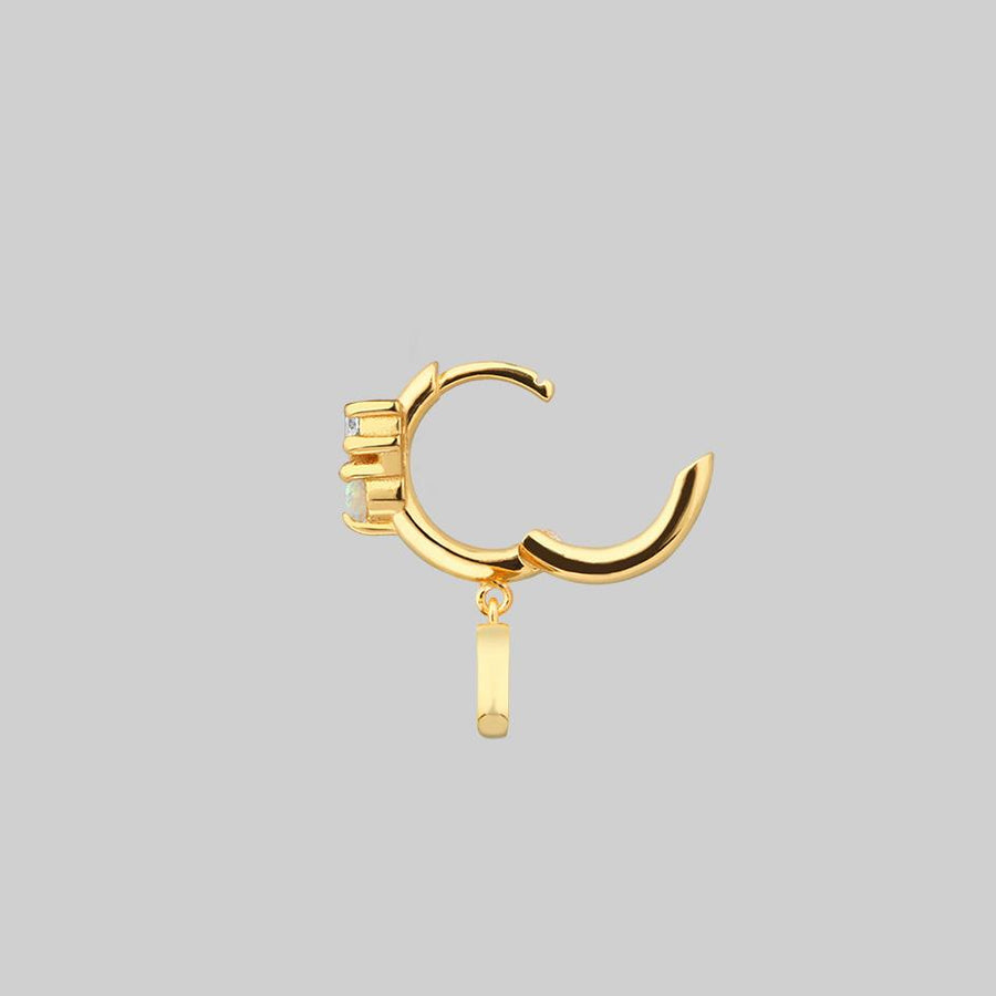 single gold hoop earring with moon
