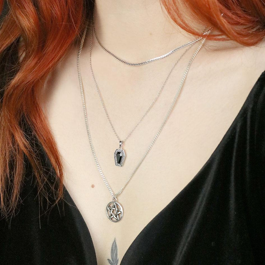 layering silver necklaces 