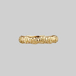 Floral gold posey ring with words inside 