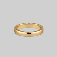 gold band ring with words and skull